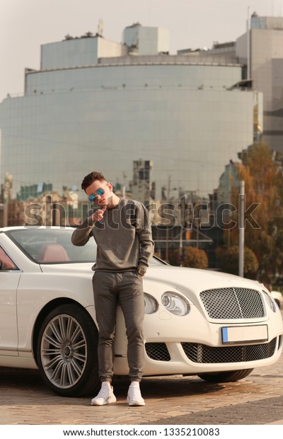 Sexy, rich, guy. Model. Man. Male. Luxury.\
Success, successful, Bentley, supercar, car, super car. Comfort,\
Lux, Vehicle driver. Auto, automobile.\
