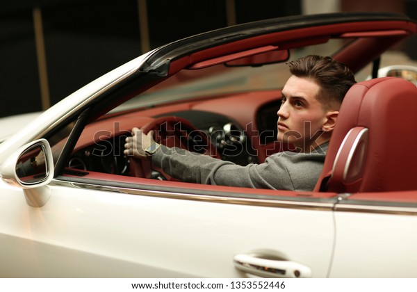 Sexy, rich, guy.\
Model. Man. Male. Bentley. supercar, car, super car. Attractive.\
Comfort. Lux, luxury, Vehicle driver. Auto, automobile. Success,\
successful. Happy dream.\
Young.