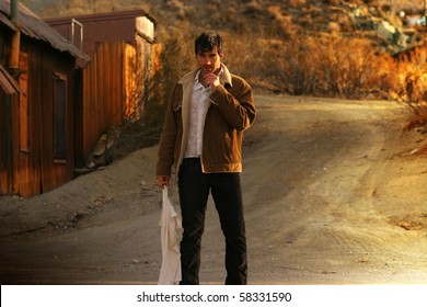 Sexy Rugged Man Standing In The Middle Of A Rural Road