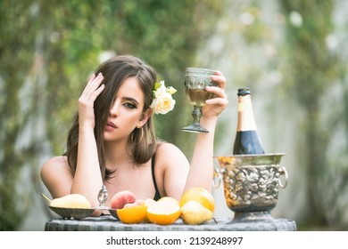 Sexy Sensual Woman Relaxing And Drink Champagne. Exotic Summer Diet, Tropical Fruits.