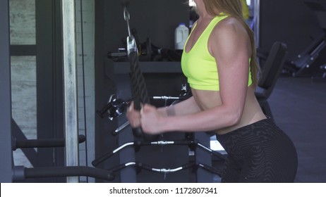 Sexy Sportswoman With Perfect Body Doing Rope Pull Down Exercise