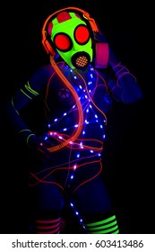 sexy UV neon disco woman wearing fluorescent gasmask.