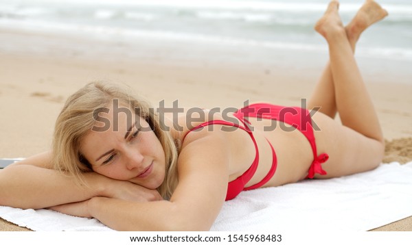 Sexy Woman In A Bikini Relaxes On A Sandy Beach At The Ocean Travel Photography