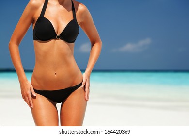 Sexy Woman Body On The Beach Background