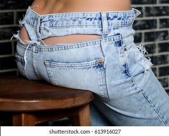 torn butt jeans