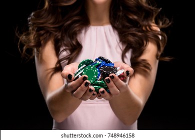 Sexy Woman In A Chic Gently Pink Dress Holding Colored Poker Chips. Woman Winning