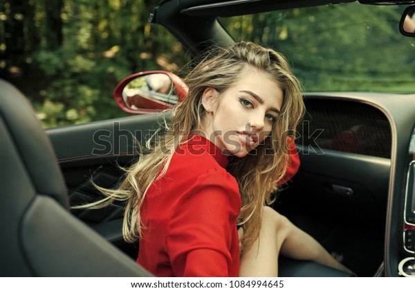 Sexy woman drive car, fashion, beauty. Modern\
life, luxury, city, glamour. Business trip or commanding, happy\
girl driver. Businesswoman or pretty woman in convertible car.\
Travel and summer\
vacation.