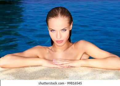 Sexy Woman At The Edge Of Swimming Pool