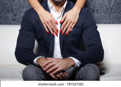 Sexy Woman Hands With Red Nails Touchning And Embracing Rich Man