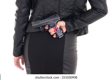 sexy woman hiding gun behind her back isolated on white background