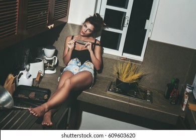 Sexy Woman With Knife In The Kitchen