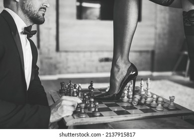 Sexy Woman Leg In Stockings And High Heels Steps Into Chess Board Black And White Concept