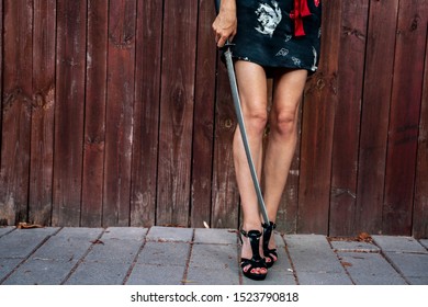 Sexy Woman Legs In High Heels, Holding Samurai Sword 