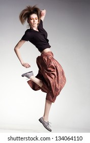 Sexy Woman Model Jumping In Large Pants - Studio Fashion Shot