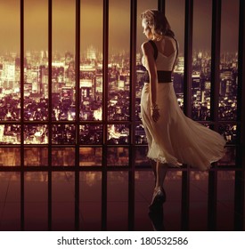 Sexy Woman Over Night City Background