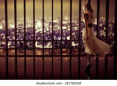 Sexy Woman Over Night City Background