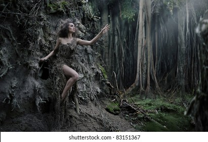 Sexy woman as a part of tree
