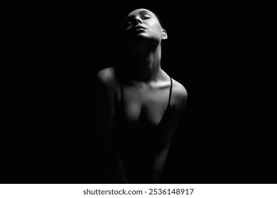 Sexy Woman silhouette in dark. Beautiful Body passion Girl over black background