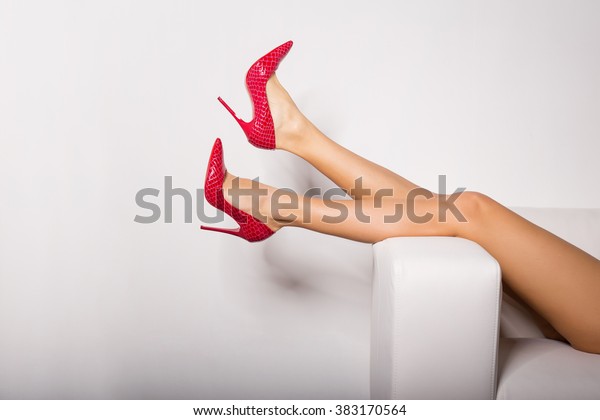 Sexy Womans Legs In Red High Heels