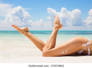 Sexy Women Legs On The Beach