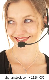 Sexy Young Adult Caucasian Businesswoman In A Formal Black Dress On A White Background With A Headset, Not Isolated