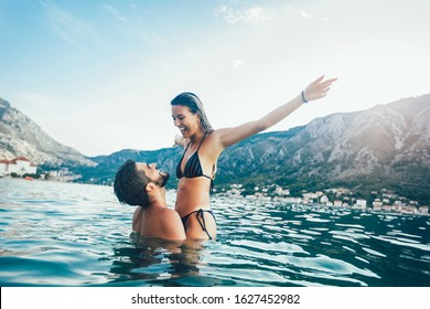 Sexy Young Couple On The Beach Having Fun