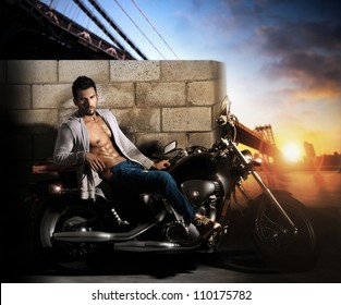 Sexy Young Fit Male Model On Motorcycle Outdoors At Dawn