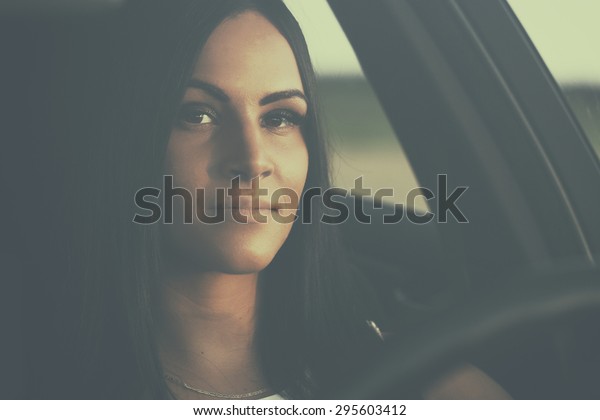 Sexy young woman in\
cabriolet car