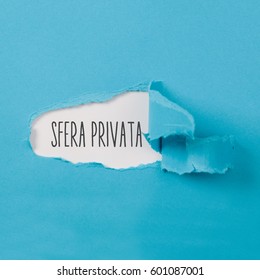 Sfera privata, Italian text for Private Sphere, text on paper revealing secret behind torn blue carton ripped open - Shutterstock ID 601087001