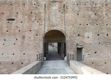 Sforza Castle in Imola, the wooden drawbridge with chains over the moat in front of the main entrance door - Shutterstock ID 2124753992