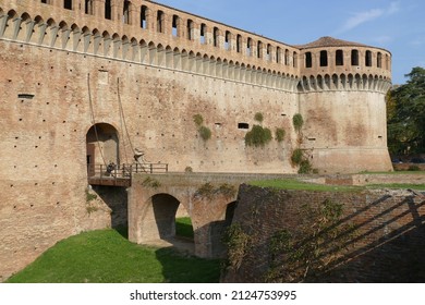 Sforza Castle in Imola, the wooden drawbridge with chains over the moat in front of the main entrance door - Shutterstock ID 2124753995