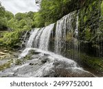 Sgwd Clun-Gwyn Waterfall at the four-waterfalls in the Brecon Beacons, Wales.