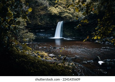 Sgwd Gwladys or Lady Falls along the Four Waterfalls walk, Waterfall Country, Brecon Beacons national park, South Wales, the United Kingdom. No people. Long exposure. - Shutterstock ID 2241435609