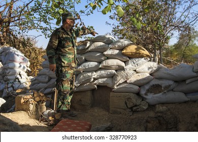 Shabaa, Syria, September 2013. A Soldier Of The Syrian National Army Shows The Reconquered Territory From The Rebels In The Suburbs Of Damascus.