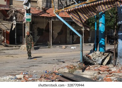 Shabaa, Syria, September 2013. A Soldier Of The Syrian National Army Shows The Reconquered Territory From The Rebels In The Suburbs Of Damascus.