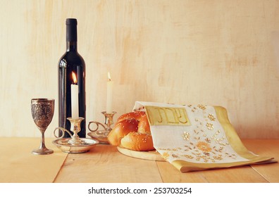 Shabbat Image. Challah Bread, Wine And Candelas On Wooden Table. 