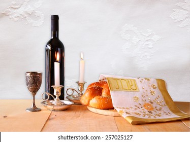 Shabbat Image. Challah Bread,wine And Candelas On Wooden Table. 