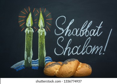 Shabbat Shalom - Jewish and Hebrew greetings. Candles painted on a chalkboard. May you dwell in completeness on this seventh day.