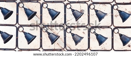 Shabby Antique Fence Texture. Black Bells Pattern. Bronze or Copper. Vintage Grunge Photo