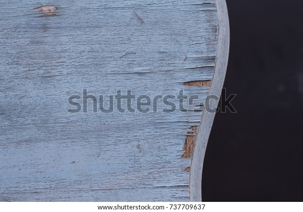 Shabby chic background in black and pastel\
blue wooden grunge texture. Curved table border, minimal\
composition, layered\
wallpaper.