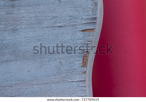 Shabby chic background in pink and pastel blue\
wooden grunge texture. Curved table border, minimal composition,\
layered wallpaper.