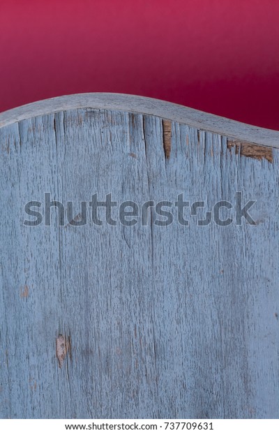 Shabby chic background in pink and pastel blue\
wooden grunge texture. Curved table border, minimal composition,\
layered wallpaper.