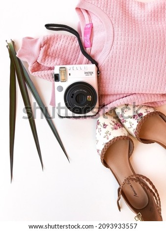 shabby chicks items with polaroid camera and floral flat shoes