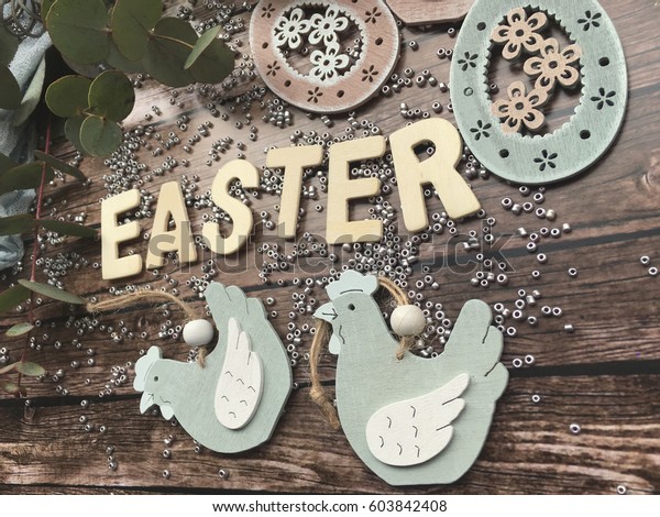 Shabby Easter. Easter wooden\
letters. Easter wooden text on wooden background. Concept Easter.\
