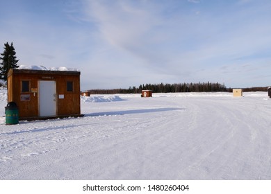 Shack Made Of Plywood For Ice Fishing On A Frozen Lake In Alaska, USA