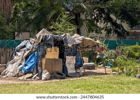a shack on a city street. The homeless man's home.