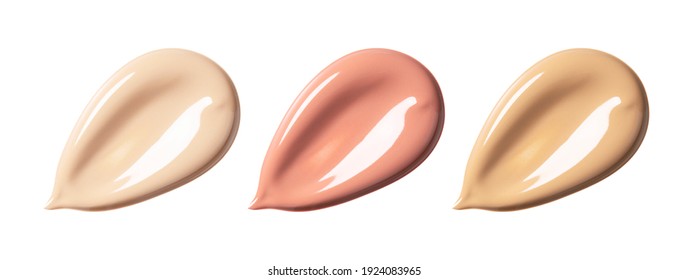 Shade of foundation on white background. Close-up of liquid foundation in various tones, textures of make-up products.