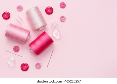 Shades Of Pink. Closeup Top View Of Sewing Equipment And Material For Fabric