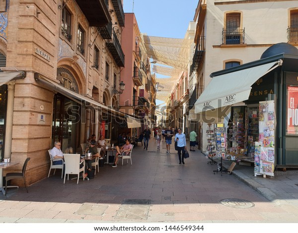 Shades in Sierpes Street and surrounding\
passages in Seville Old Town getting ready for the hot summer\
temperatures. June 3, 2019. Seville,\
Spain.