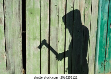 Shadow With An Ax In Hand